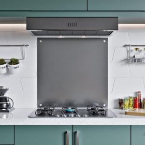 Front view of stainless steel splashback installed behind stovetop in a contemporary kitchen