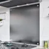 Stainless steel splashback installed in a modern kitchen above a gas hob