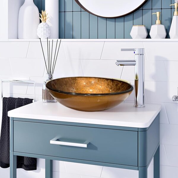 round gold glass basin on a modrn countertop