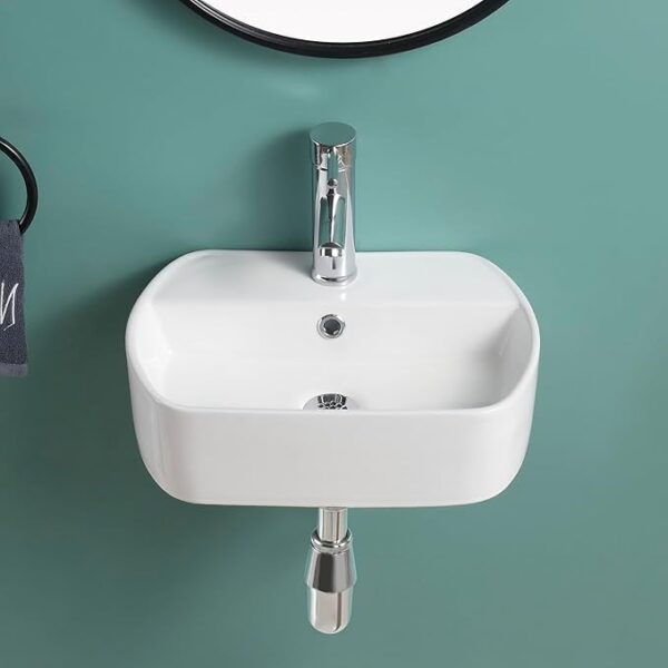 Modern white ceramic wall hung basin with pop-up waste and bottle trap